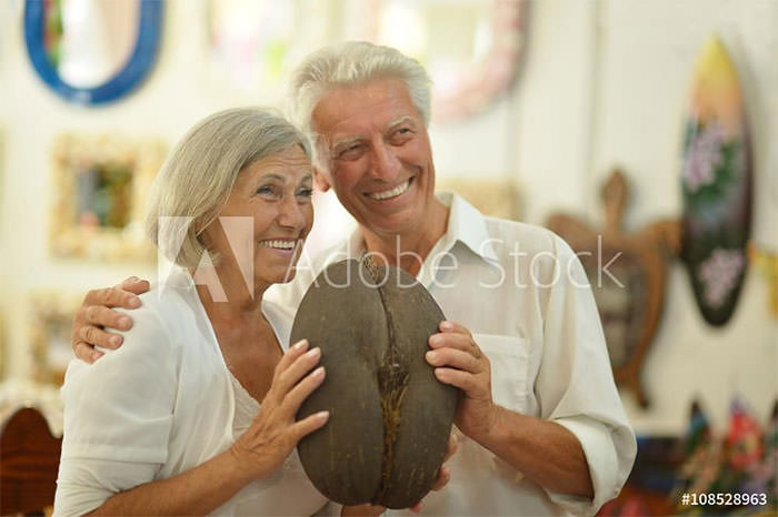 Happy older couple selects perfect elephant butt replica