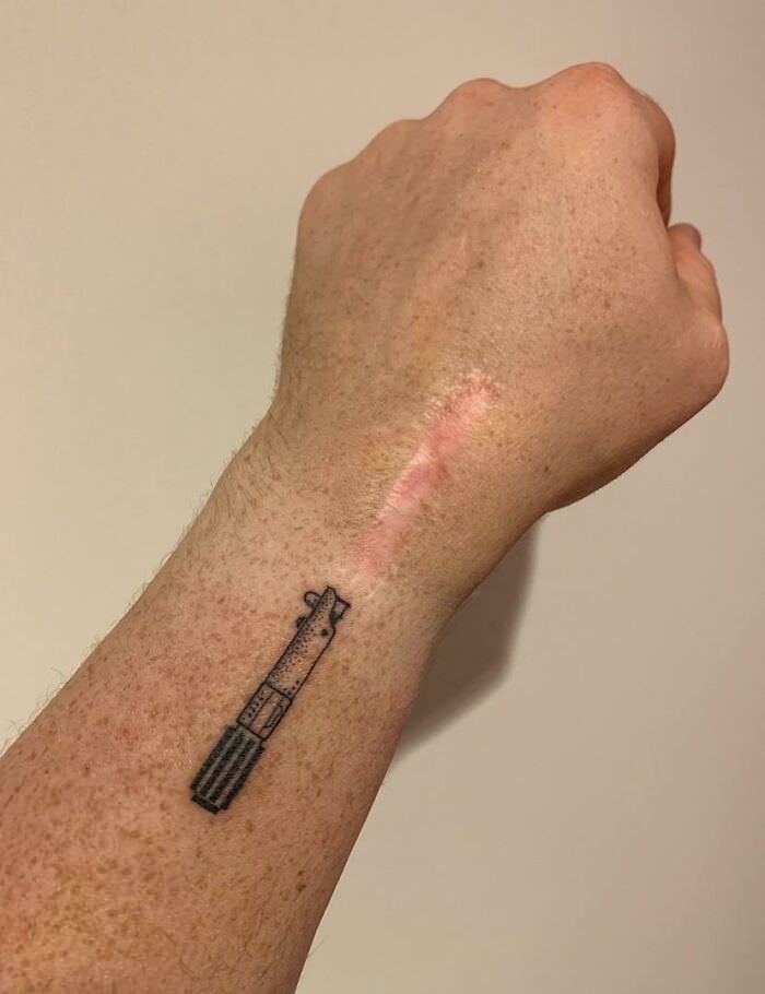 Just got a lightsaber tattoo to add to an old scar