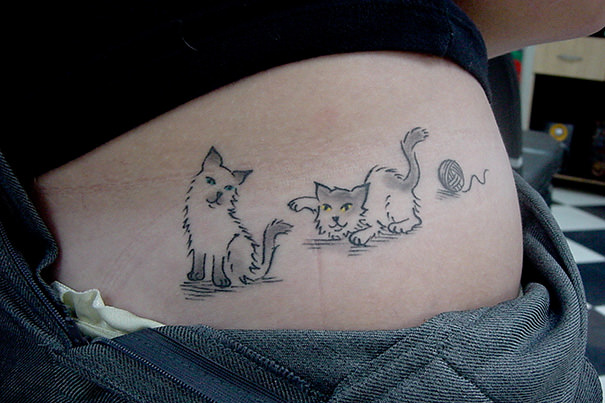 Playing cats tattoo