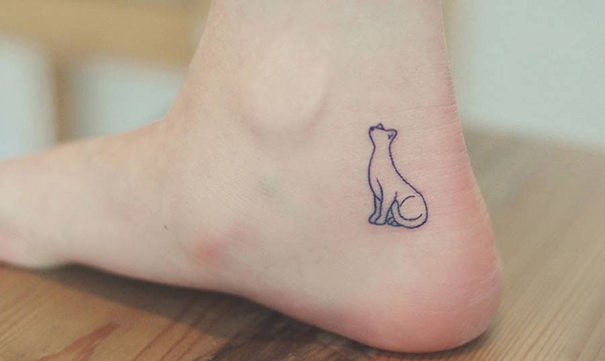 Minimalistic cat tattoo