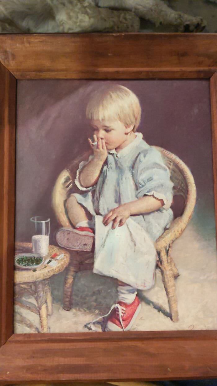Little boy’s fingers used to create a jazz cigarette in a painting