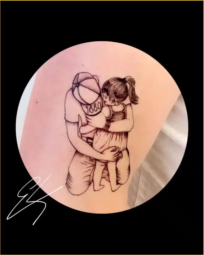 A daughter's heartfelt tribute to her dad, with a tattoo design etched on her shoulder blade.