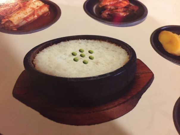 The peas in this menu photo appear to be photoshopped in.