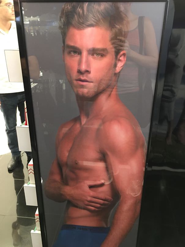 An unusual advertisement for underwear with an oversized model head.