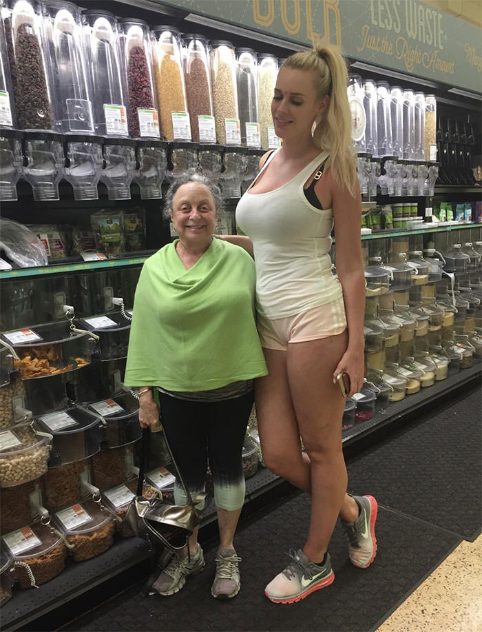 My short mom loves taking pictures with really tall people and sharing them with the family.