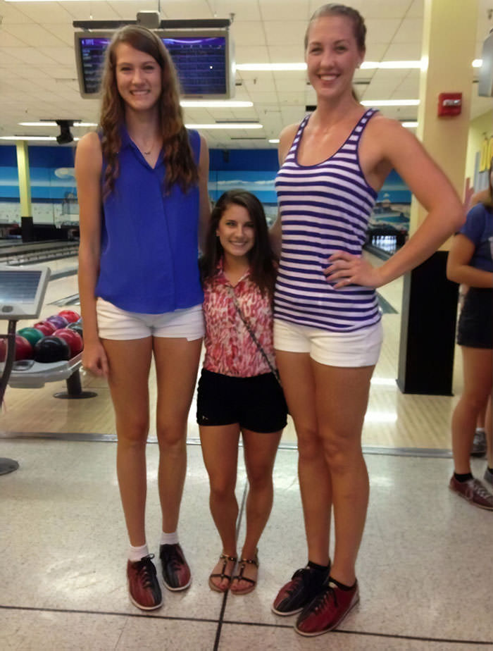 The difference between UCF's two tallest volleyball players and their shortest cheerleader.