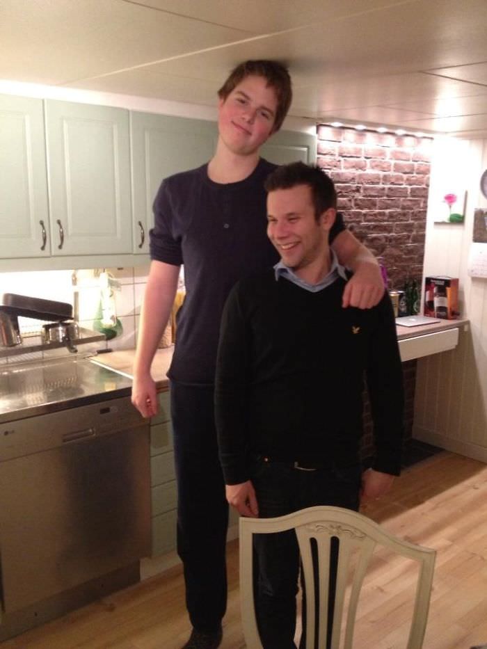 That's me (18, 6'7) next to my pal in their house - I hate their house...
