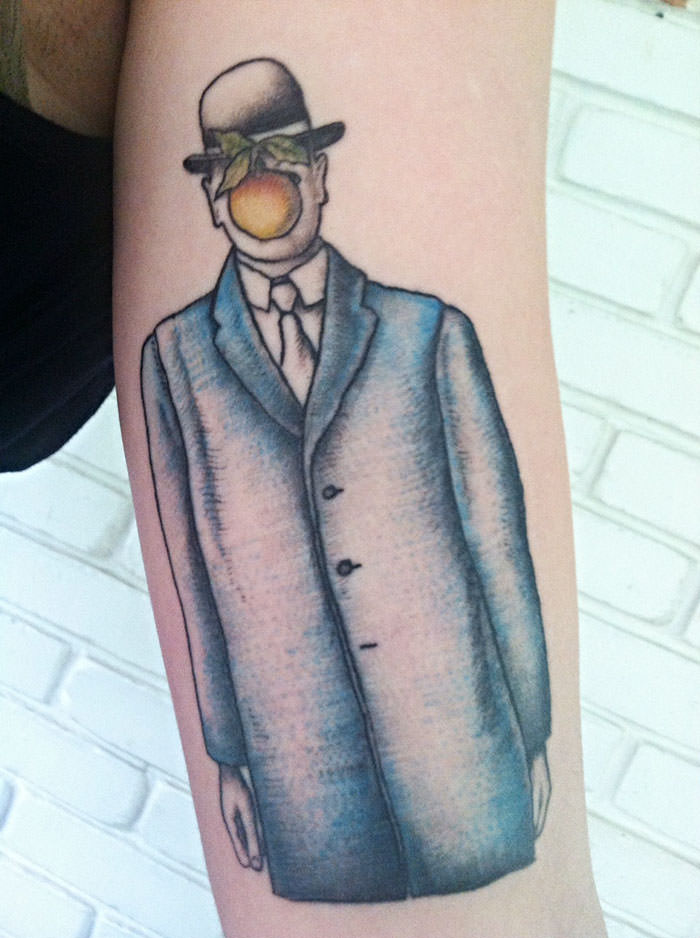 A tattoo inspired by Rene Magritte's art