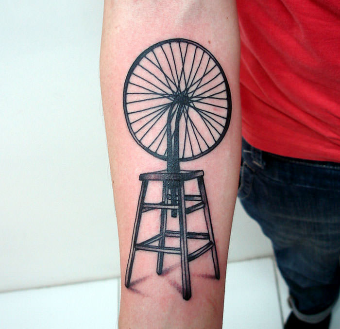 A tattoo inspired by Marcel Duchamp's "Bicycle Wheel"