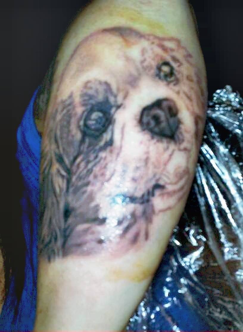 Yes, this is a dog with a really bad tattoo.