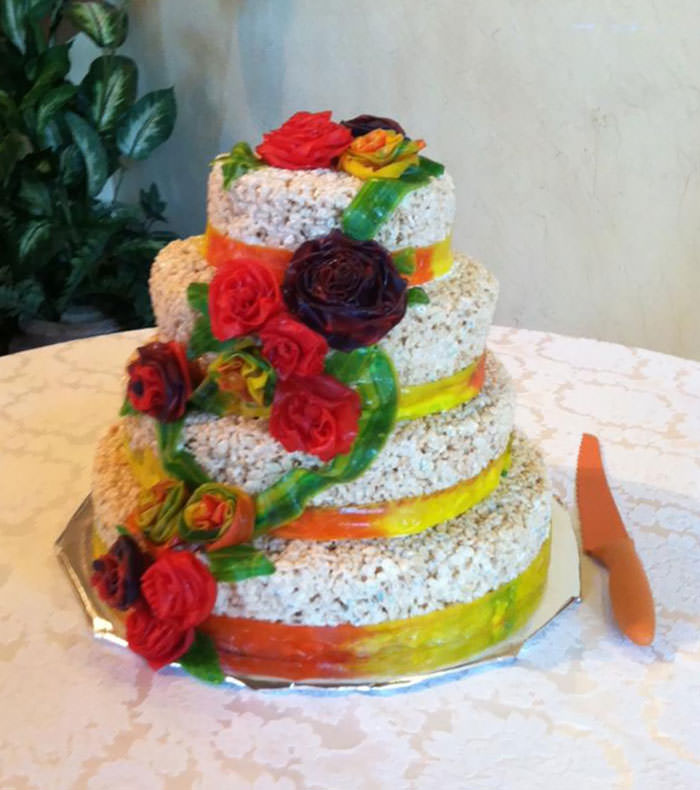 A cousin's wedding cake was made with Rice Krispy treats and fruit by the foot flowers.