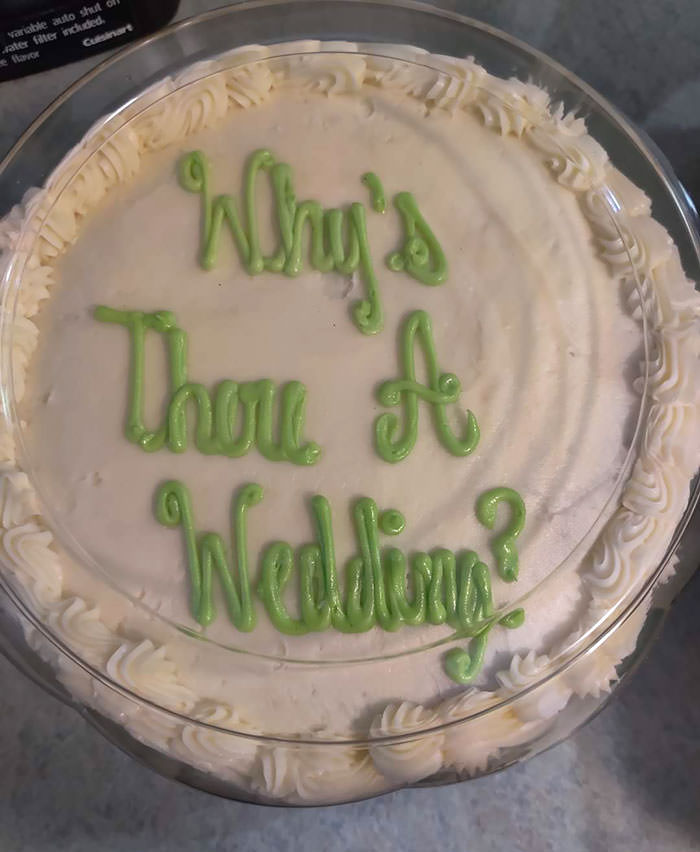 This cake was supposed to spell "Wiser Wedding."