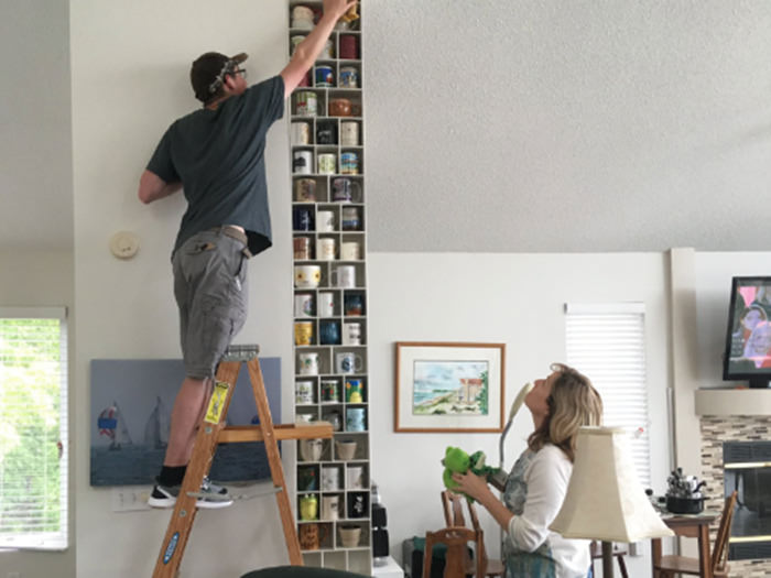 Collecting coffee mugs with a wall display