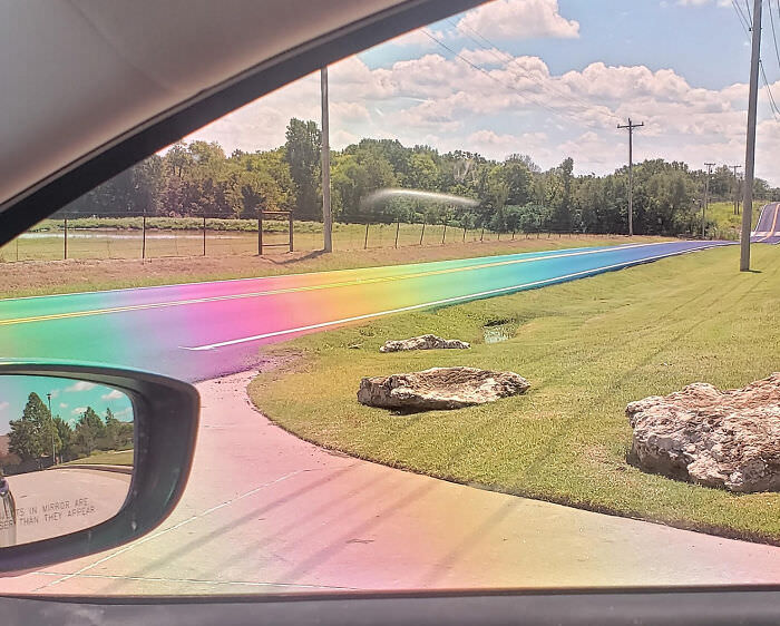 The sun hitting freshly-paved tarmac just right and making a real-life rainbow road through polarized lenses.