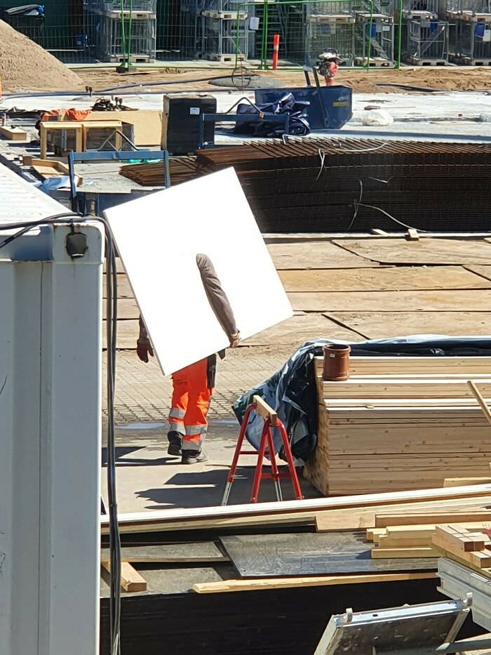 A construction worker that looks like he is glitching.