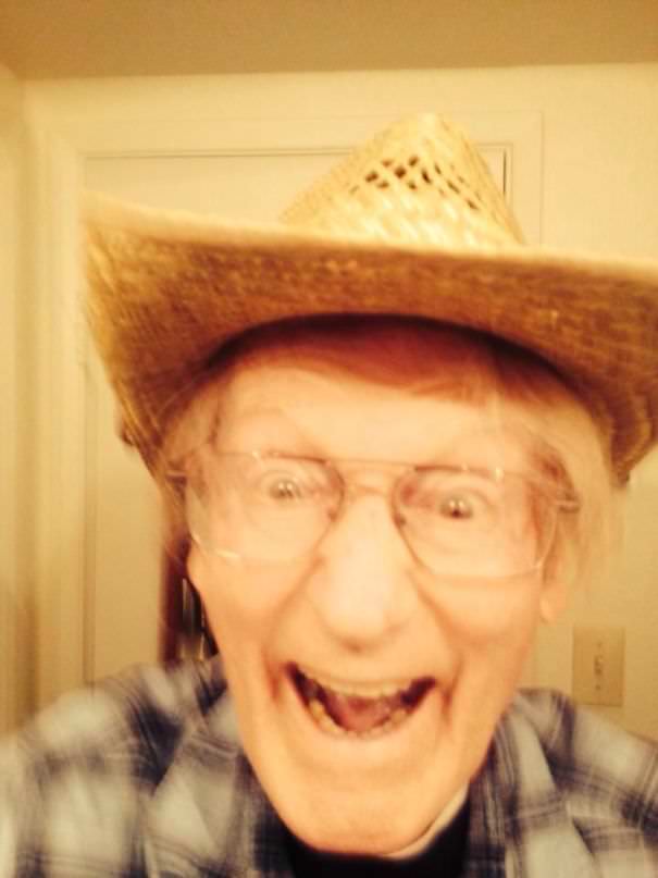 Grandpa sends a text message after taking his first selfie while home alone.