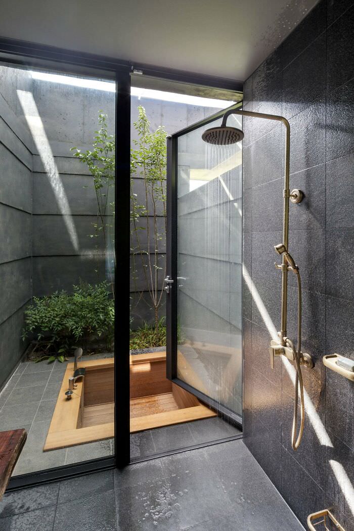 A sunken wood bath in a tiny secluded courtyard with greenery in Yangpyeong County, Gyeonggi Province, South Korea