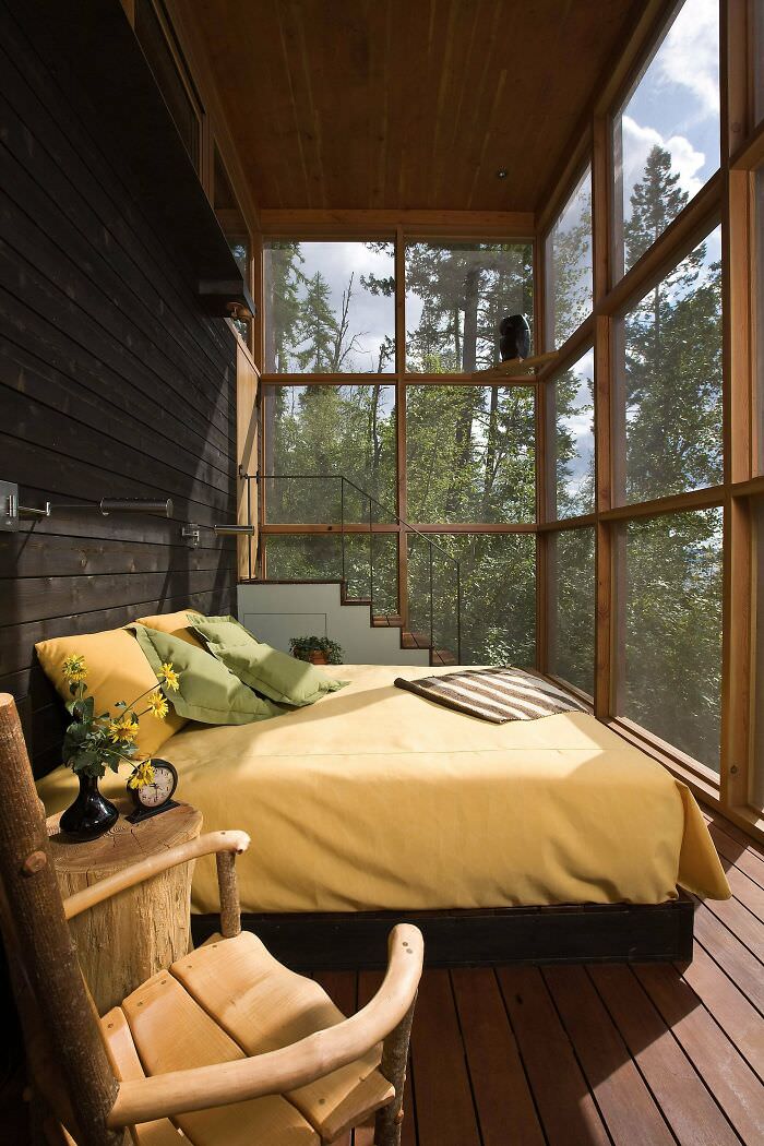 A wood bedroom in a retreat in the wilderness in Bigfork, Flathead County, Montana