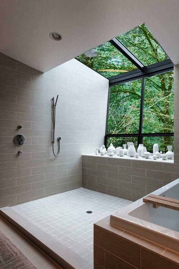 A contemporary bath and shower with an amazing view of the outdoors in a home located in Portland, Oregon.