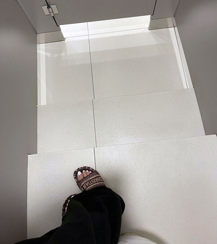 Big steps in a toilet cubicle in a mall. Fell while walking to the door after turning to flush.