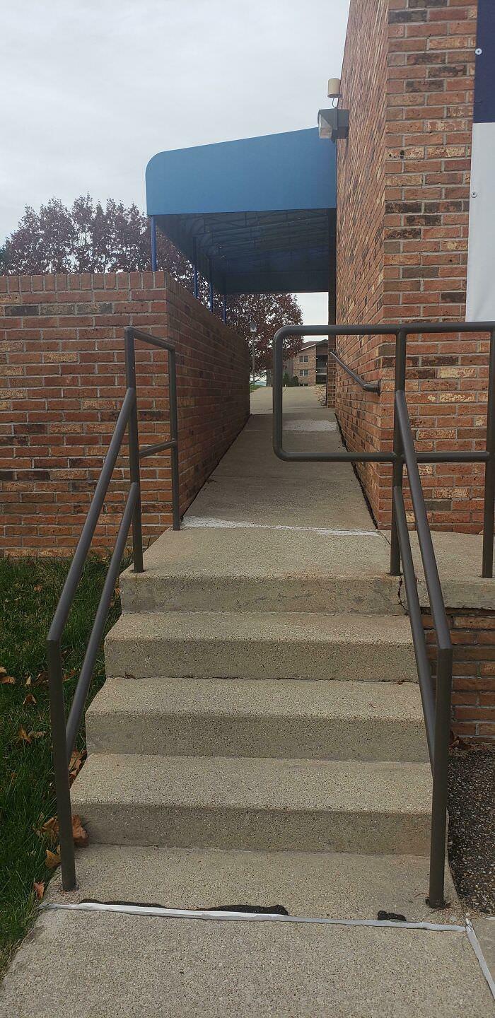 This university stairway leads halfway into the handrail.