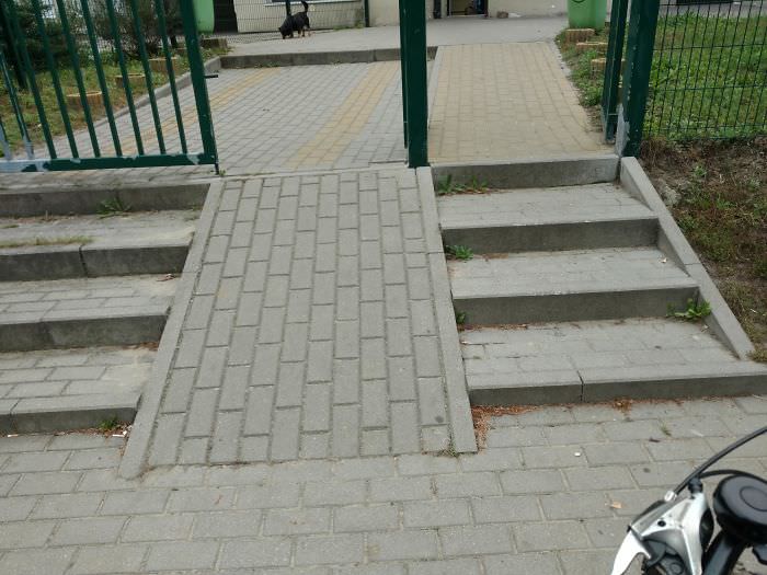 If the left ramp is chosen because of a bike or stroller, a step will be encountered later. If stairs are chosen, a ramp will be encountered after them.