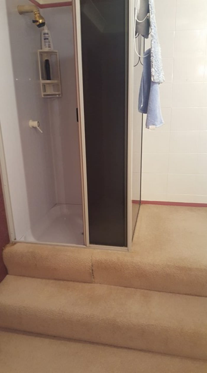These carpeted stairs lead to the shower.