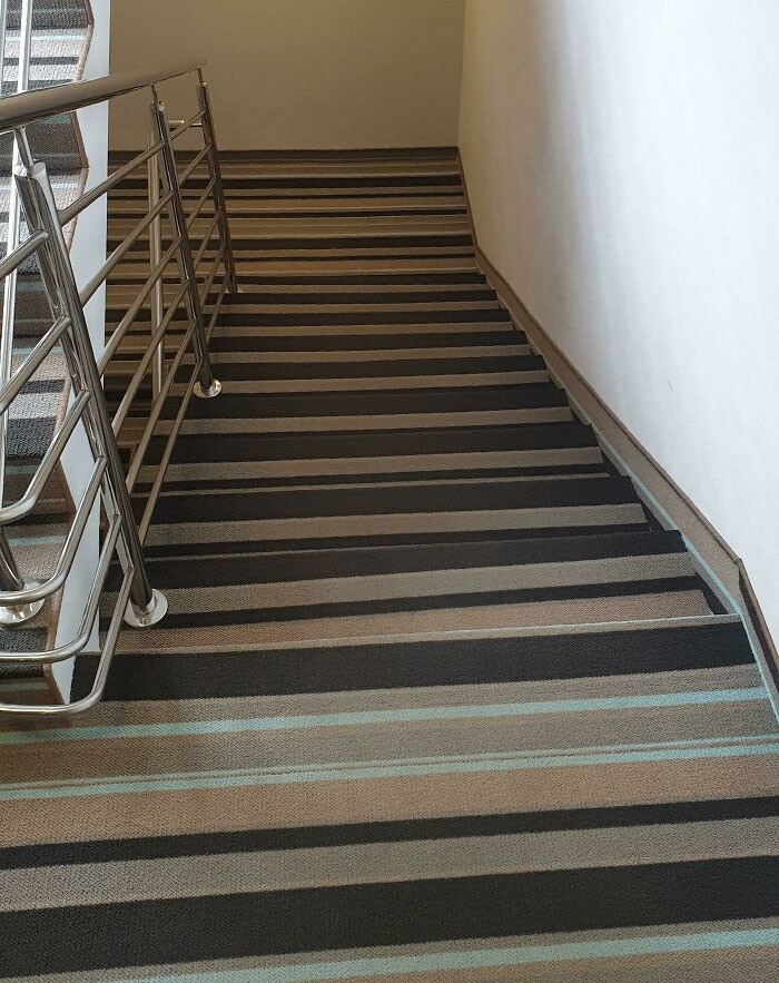 Striped carpet on hotel stairs. Hard to use even after two weeks and completely sober.