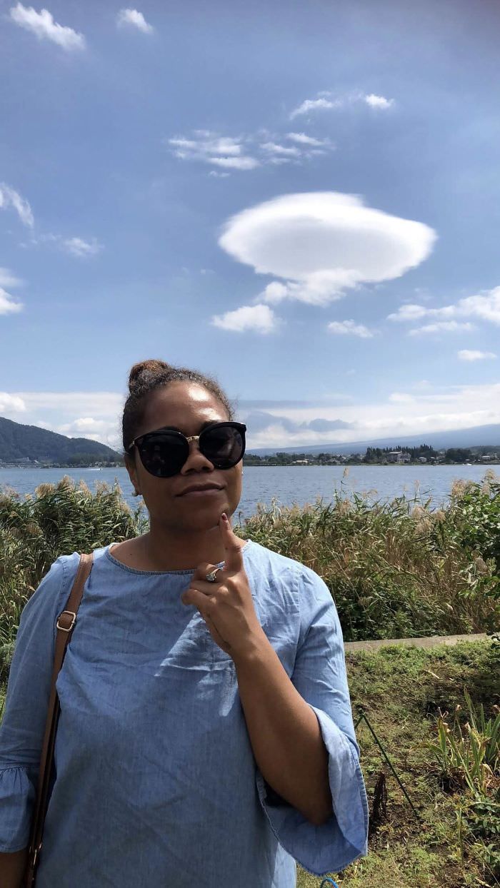 A cloud behind a person that looks like a thought bubble.