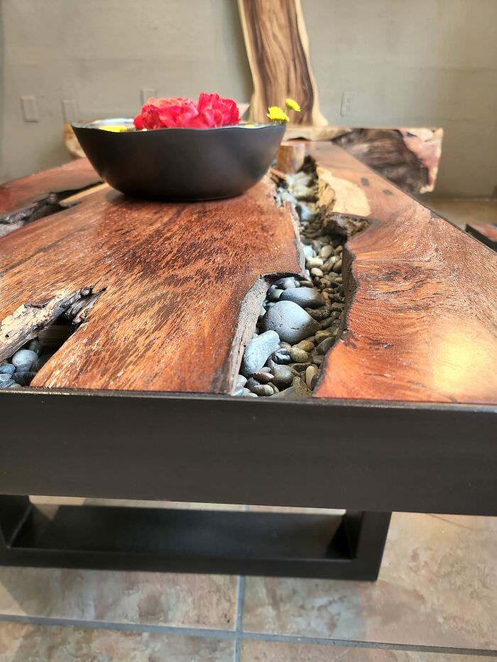 Although this coffee table looks cool, it is not practical for daily use due to the channels that can accumulate debris.