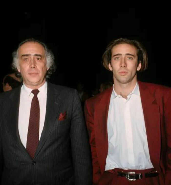 Nicolas cage and his father, august coppola, brother of francis ford coppola. 1988