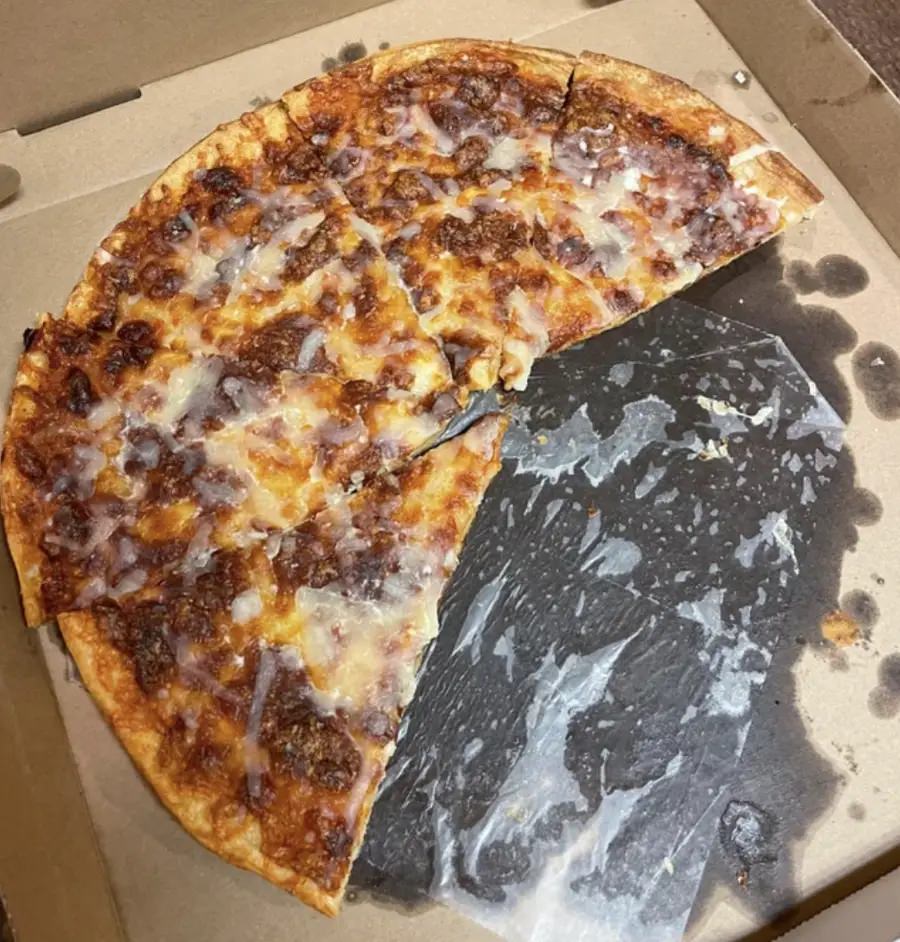 This restaurant's "fresh" cheese pizza that was re-baked with new cheese sprinkled on top: