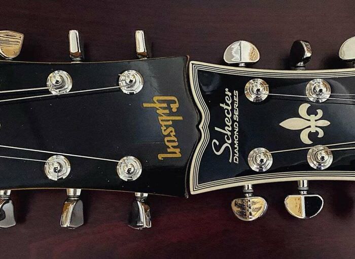 Gibson and Schecter headstocks side by side