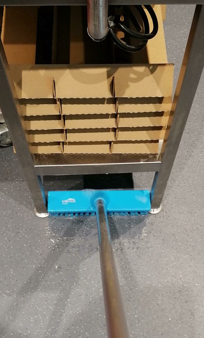 Discovered a scrubbing brush that perfectly fits under these shelves at work