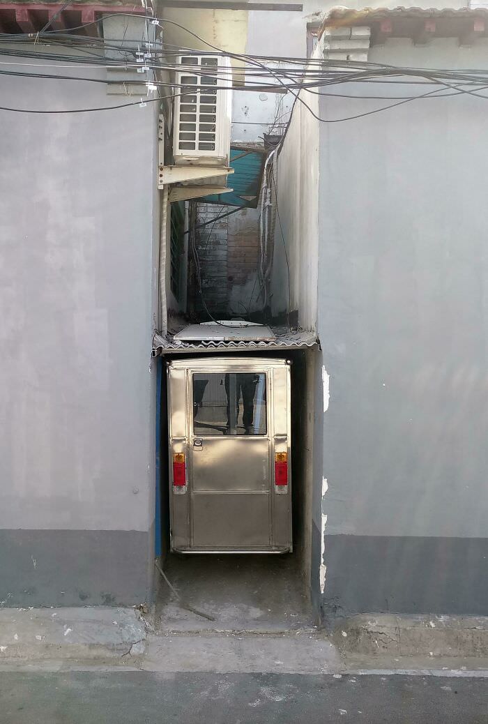 Is this a perfect fit? This parking spot was discovered between 2 buildings in a Beijing hutong