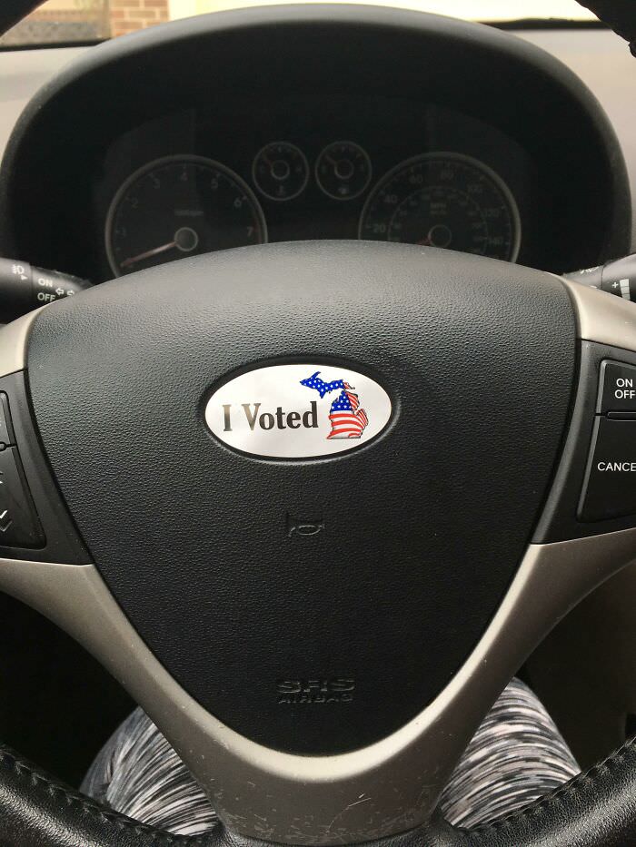 Voting sticker shares space with my steering wheel