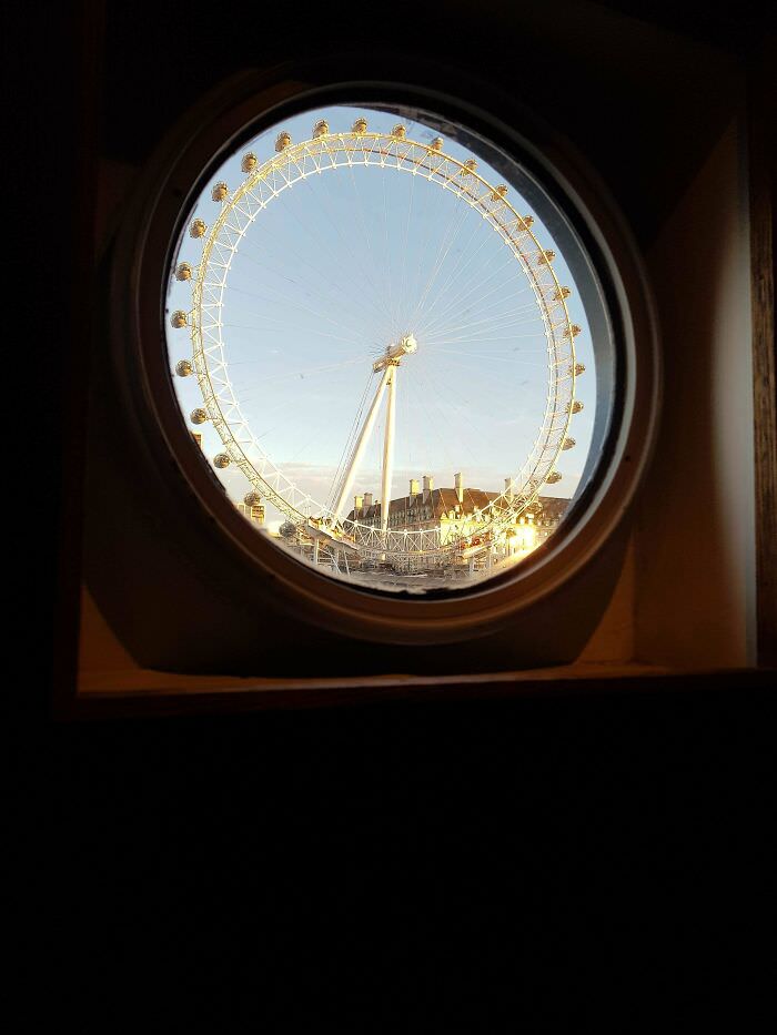 London Eye captured through a boat window on the Thames