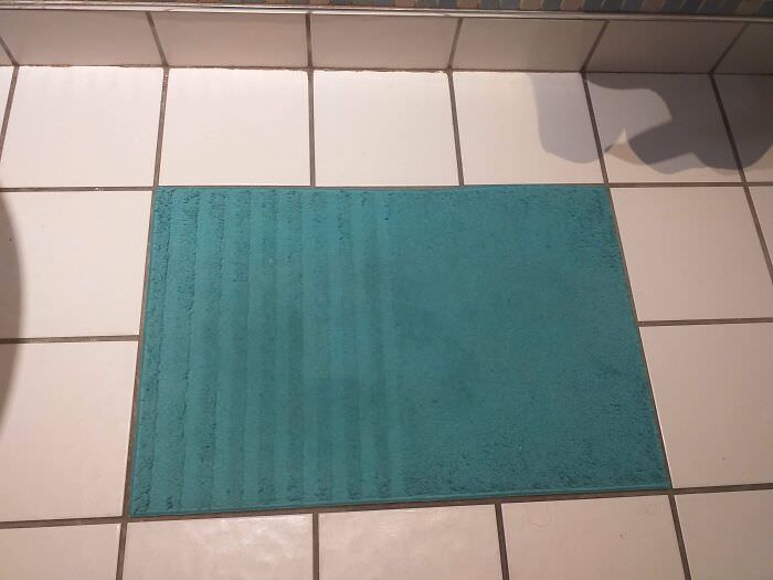 Bath mat lining up precisely with the tiles