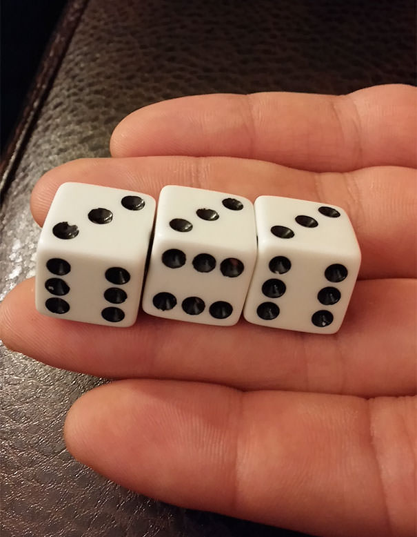 The die in the middle is printed differently.