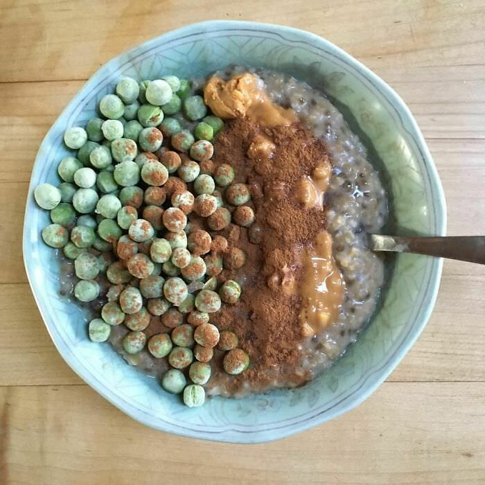 Me and my weird oatmeal combos. Today's concoction was peanut butter, chia seeds, raisins, cinnamon, protein powder & frozen sweet peas.