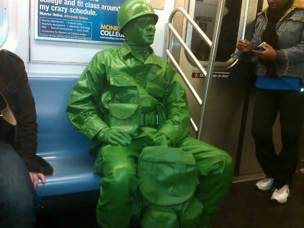 On the NYC subway, handing out little green army men to kids.