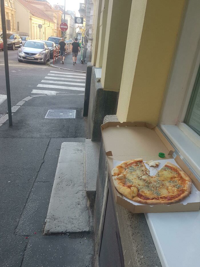 Someone ordered a blue cheese pizza and left on the street after eating one slice. Customer review at its finest