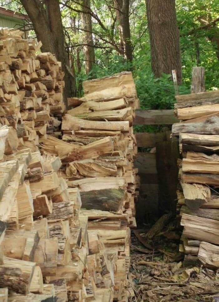 Central stack of wood. In front of the top piece.