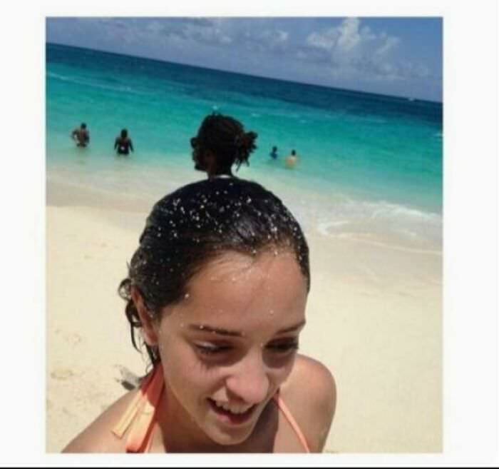 Hint: her hair is not gathered on top of her head.