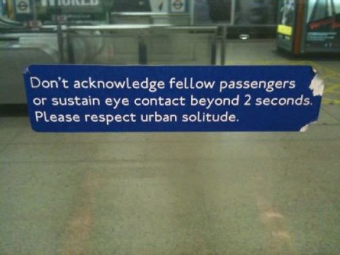 This sign on the London Underground reminds people to respect the British culture.