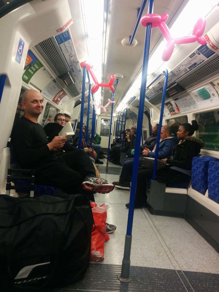 The Tube's infamous "Balloon Bandit" makes balloon animals and quickly goes back to his book.