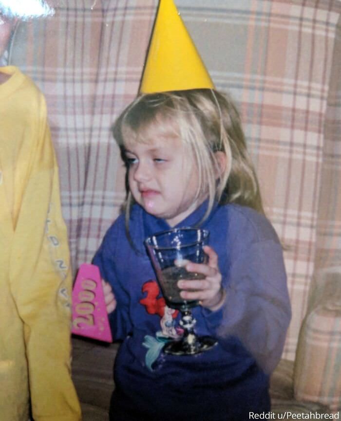My all-time favorite picture of my sister. She was 6, tired, and had just tried sparkling grape juice. Not a fan.