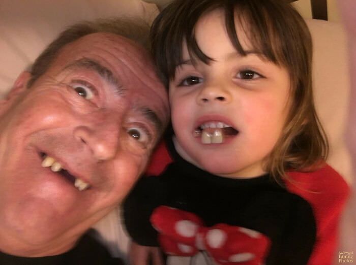 I received this photo from my dad while he was babysitting my daughter. When she found out grandpa could take out his teeth, he let her wear them.
