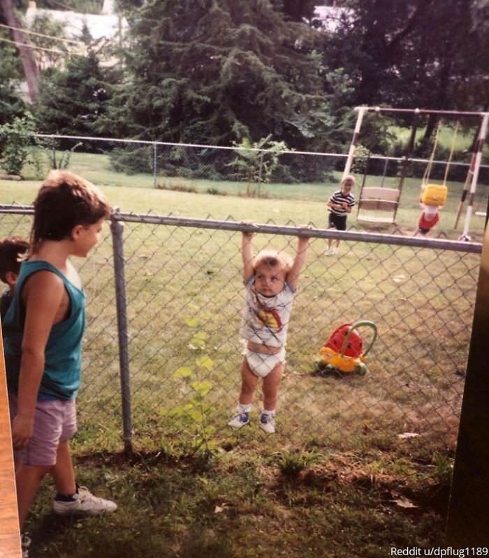 Just me, stuck on a fence in a diaper while the neighbor's kids are getting their kicks, my sister is about to eat dirt, and my brother is creepin' around in the back