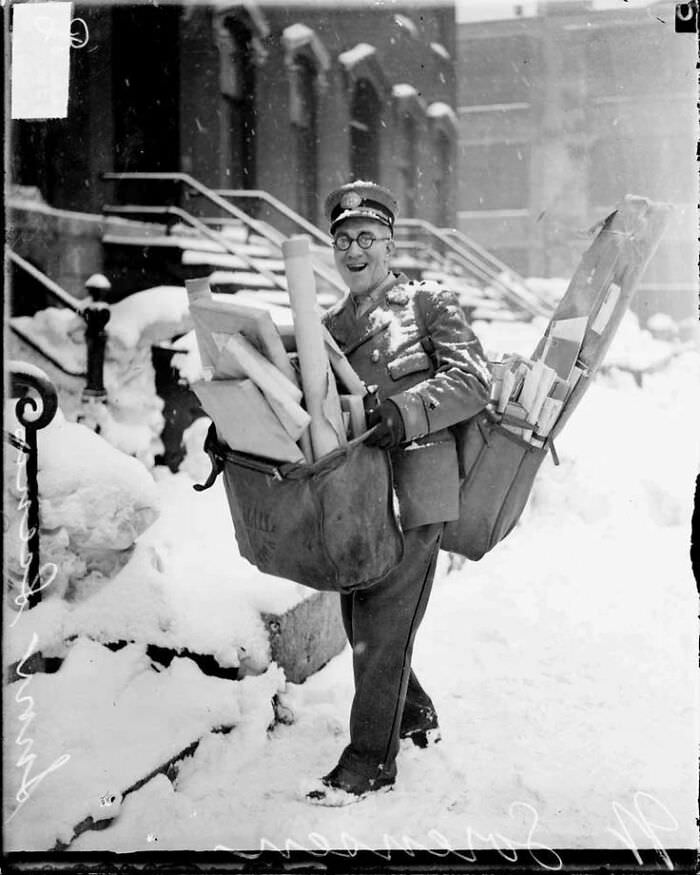 Mailman N. Sorenson poses with his heavy Christmas deliveries in Chicago, 1929.
